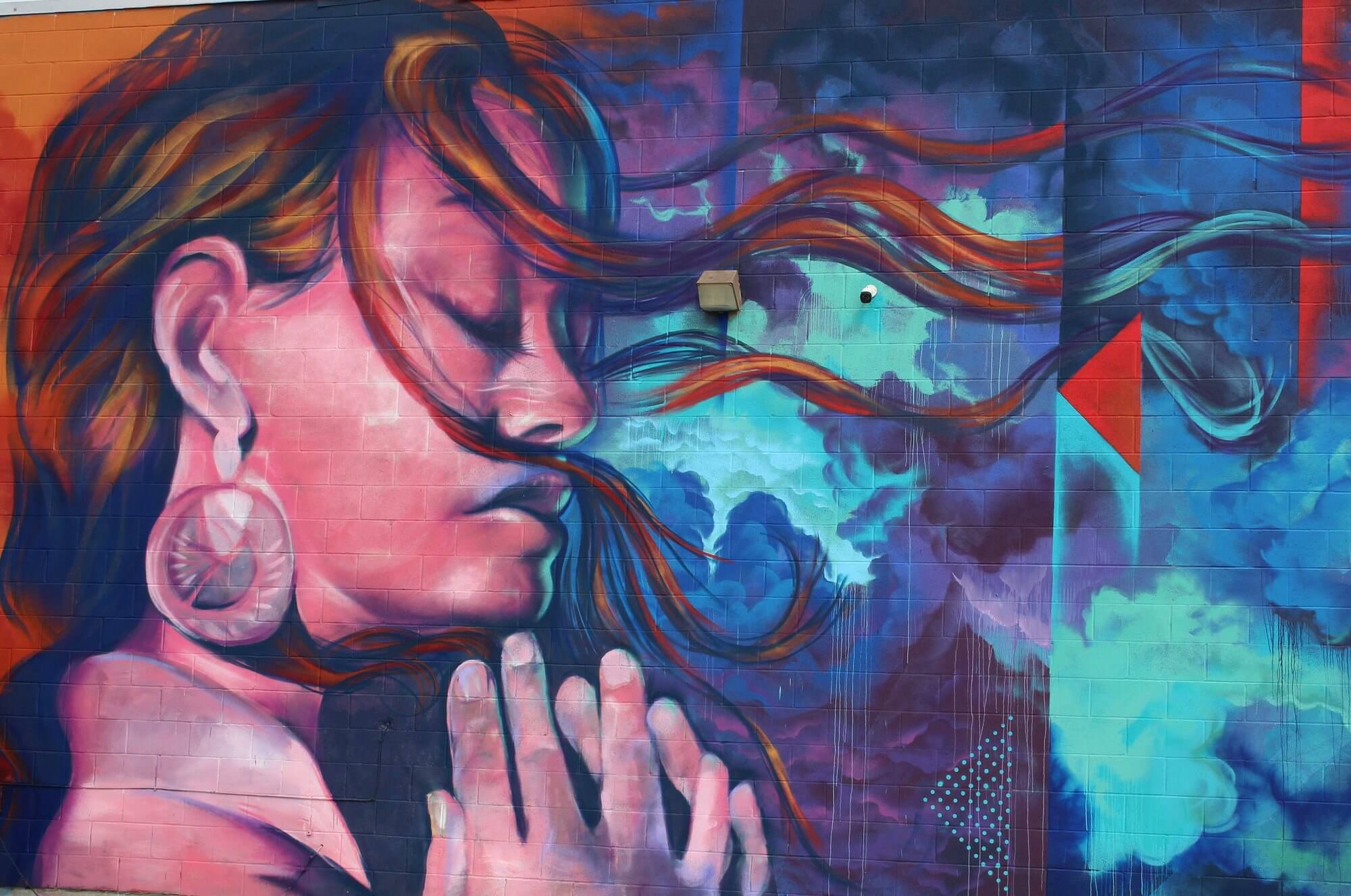 Large community mural on a neighborhood wall