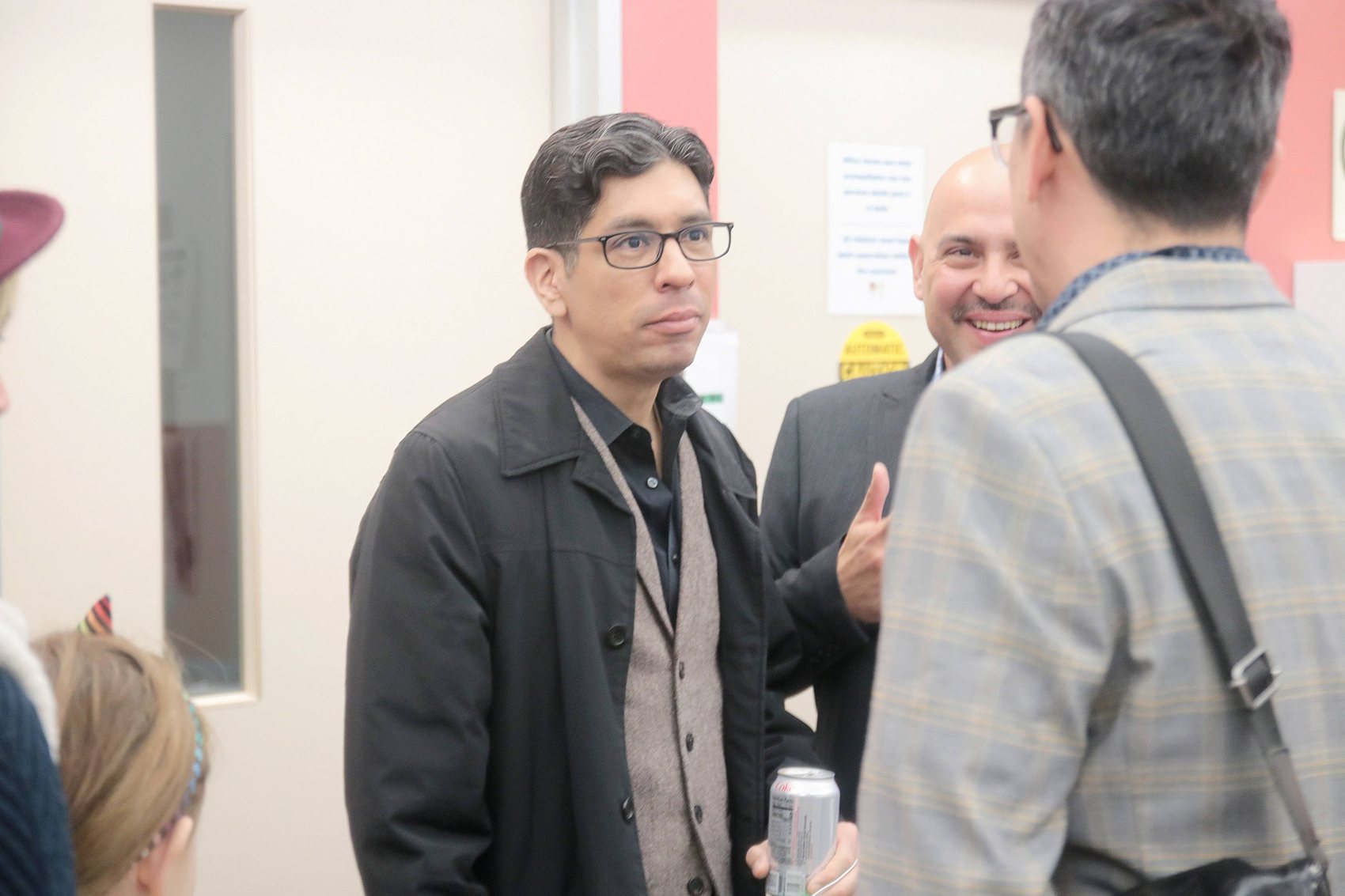 People in conversation at a community event