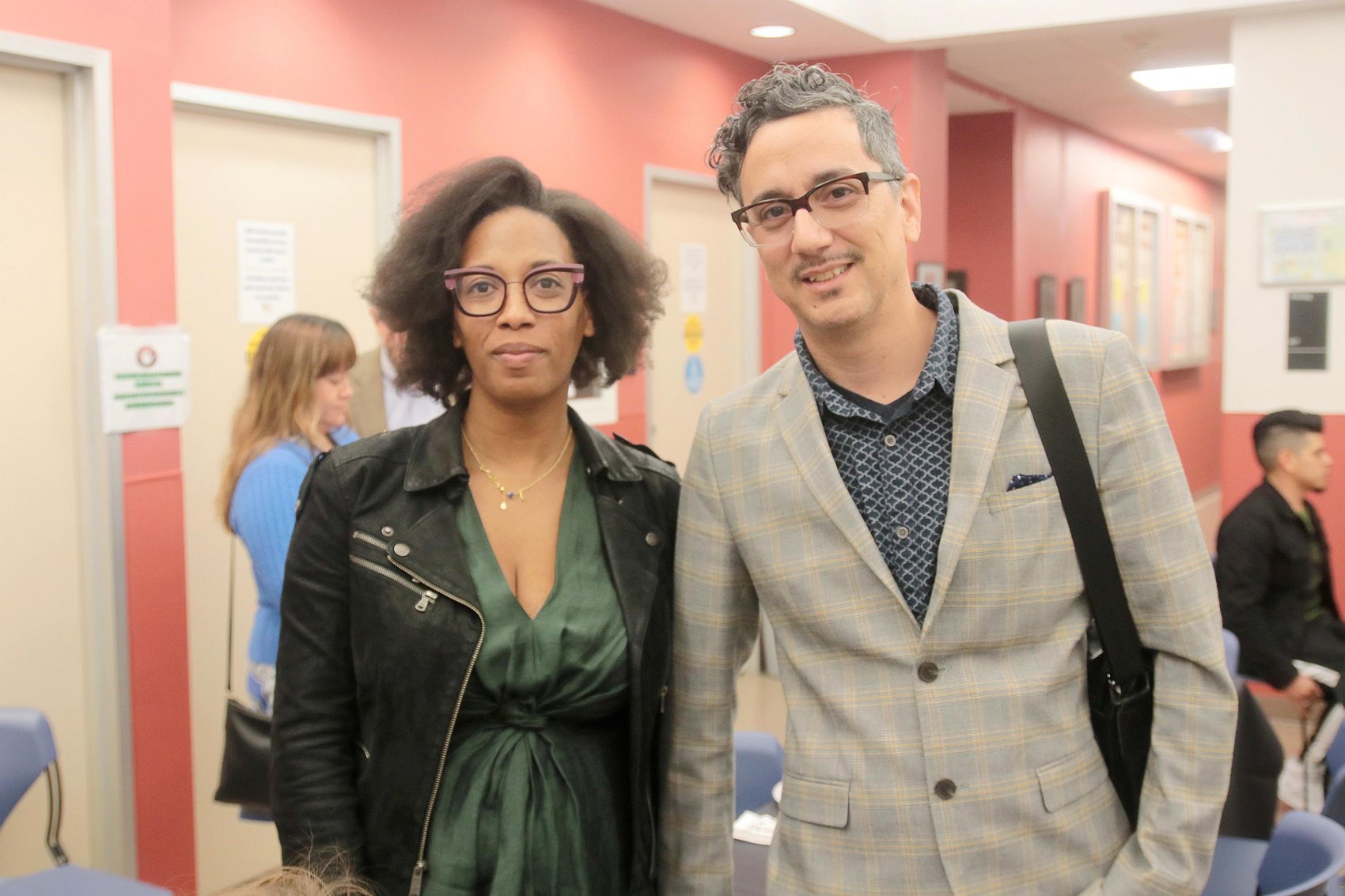 Two people standing together at a community event