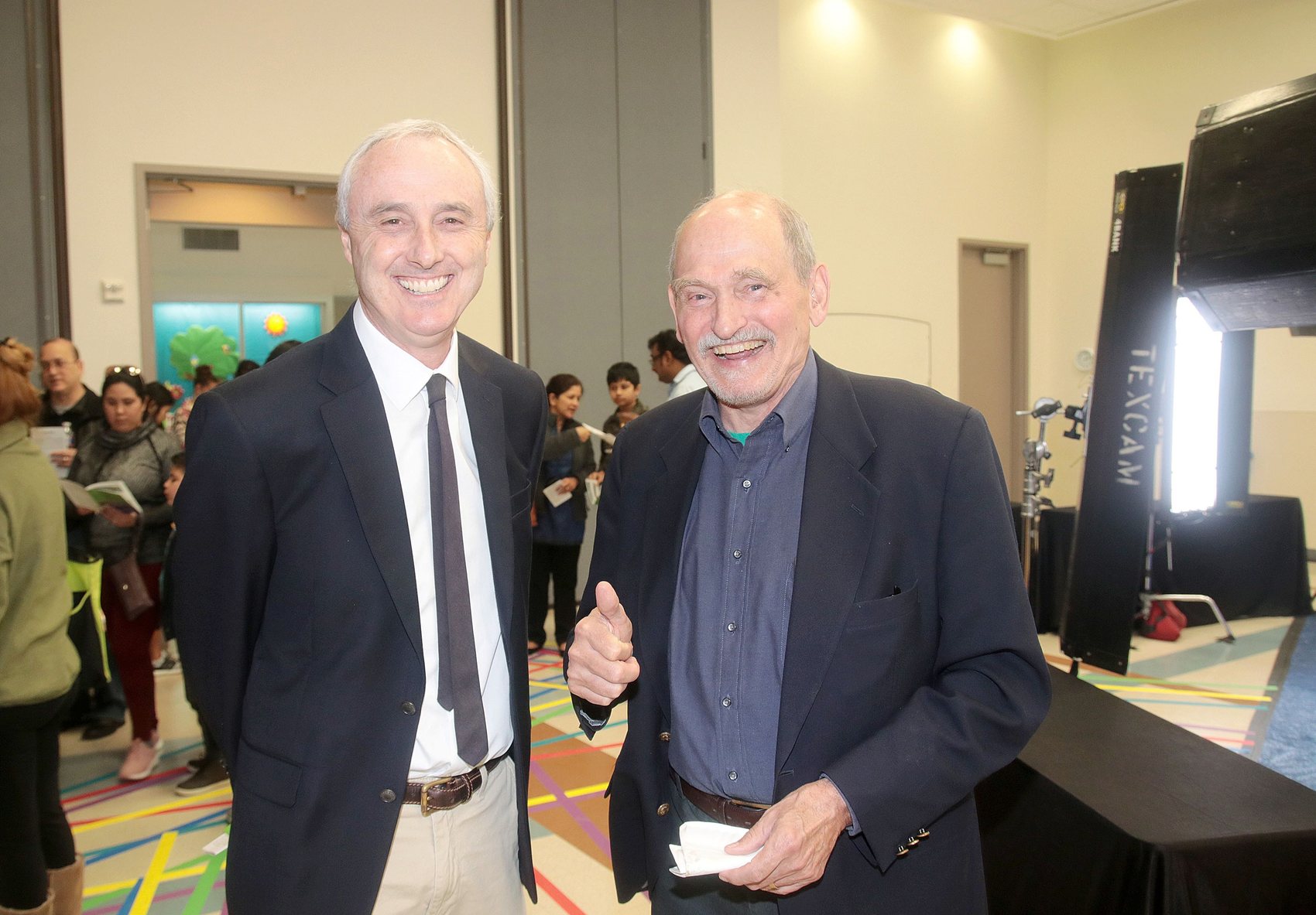 Two attendees talking at a community event